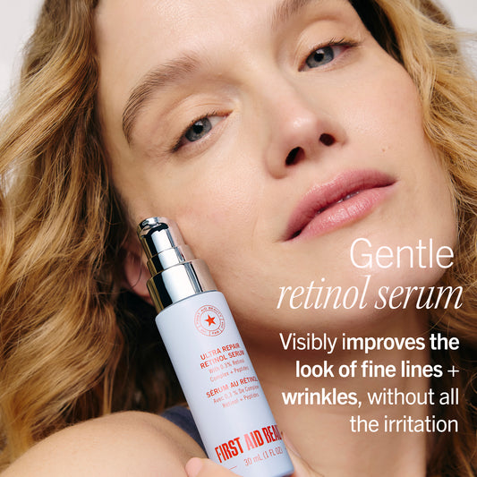 Woman holding a retinol serum bottle with text about its benefits