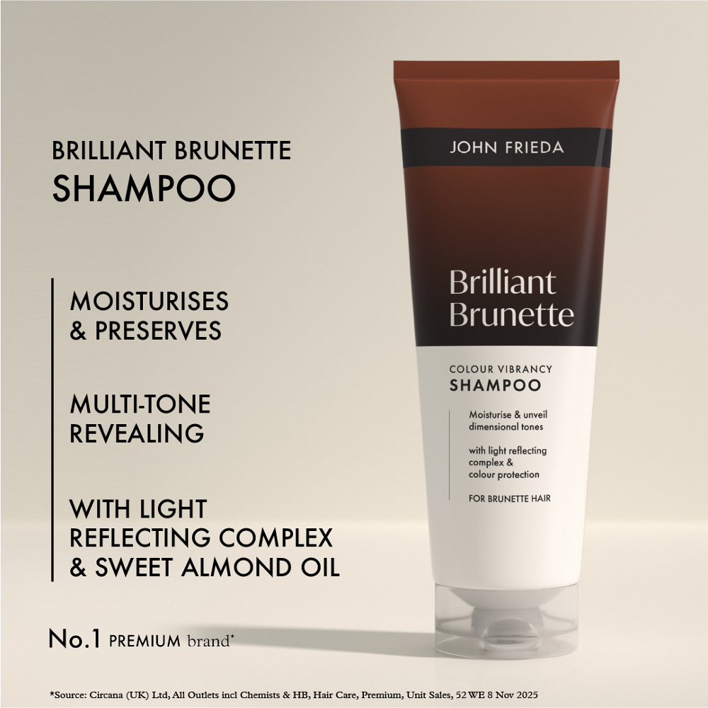 John Frieda Brilliant Brunette shampoo bottle on a beige background with product details.