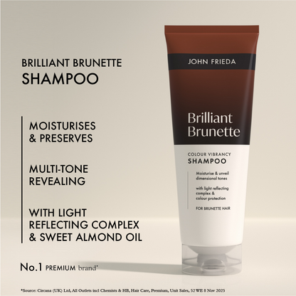 John Frieda Brilliant Brunette shampoo bottle on a beige background with product details.