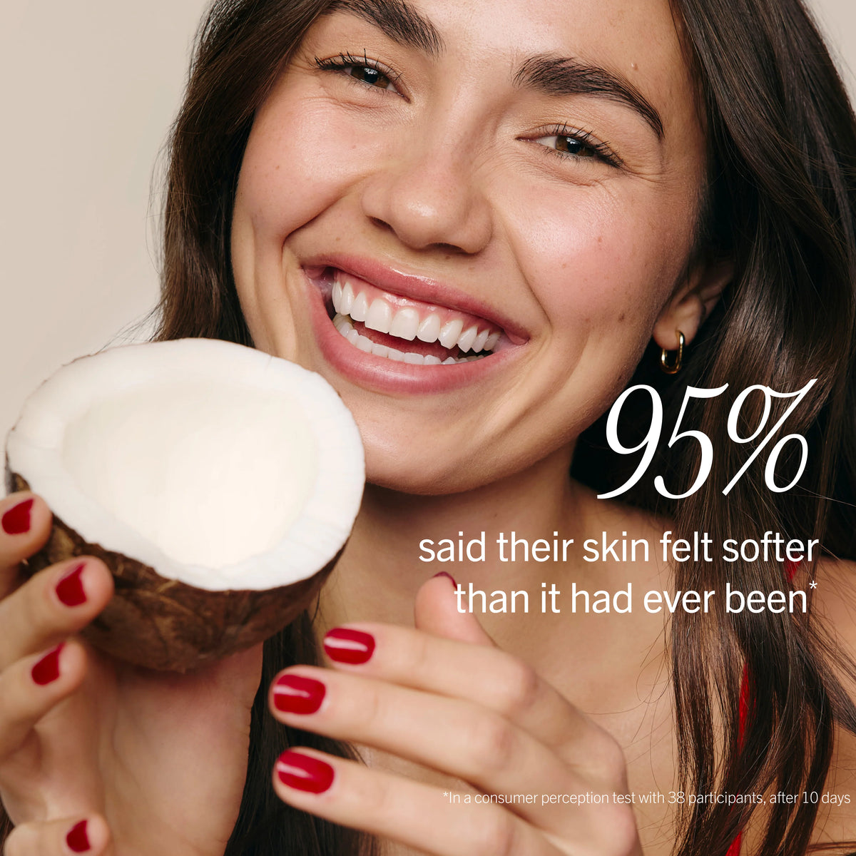 Woman holding a coconut with text about skin softness after using kp bump eraser from first aid beauty
