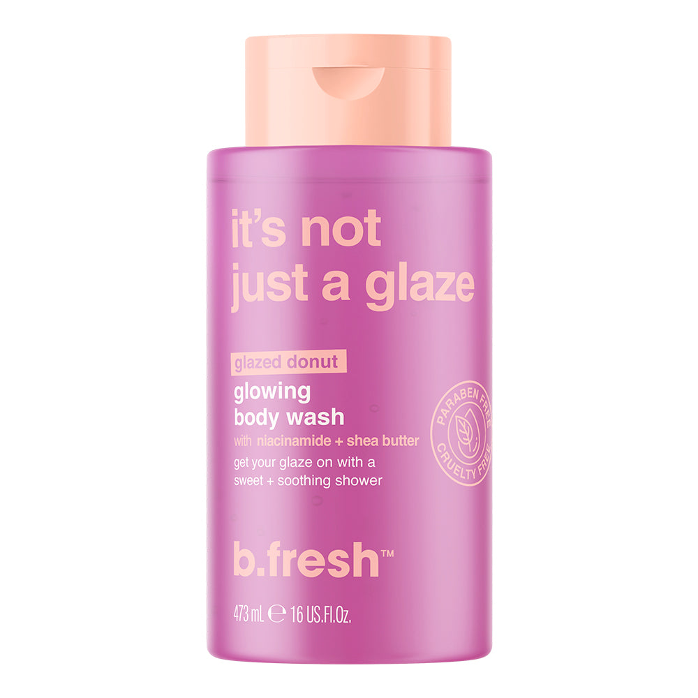 Pink body wash bottle with pink cap and text on a white background